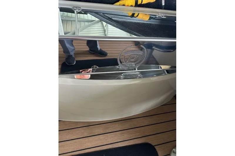 Slide: The Image of 2019 Premier 290 Grand View boat interior with wooden flooring and metal railing. - 3