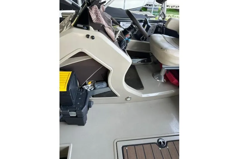 Slide: The Image of 2019 Premier 290 Grand View boat interior with steering wheel and seating area. - 5