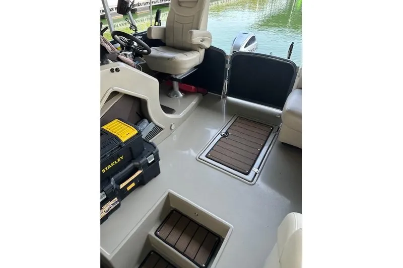 Slide: The Image of Interior of 2019 Premier 290 Grand View boat with seating and storage compartments. - 6