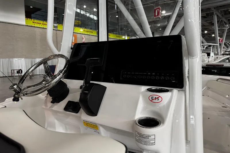 Slide: The Image of 2026 Tidewater 198 CC Adventure boat's T-top with rod holders and speakers. - 10