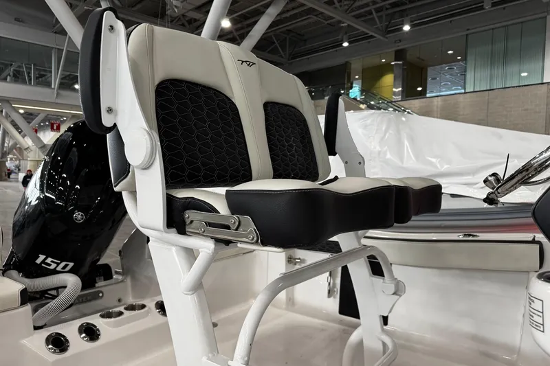 Slide: The Image of 2026 Tidewater 198 CC Adventure boat dashboard with steering wheel and controls. - 11