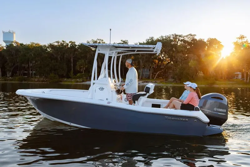 Slide: The Image of 2026 Tidewater 198 CC Adventure boat on trailer with Yamaha engine in showroom. - 2