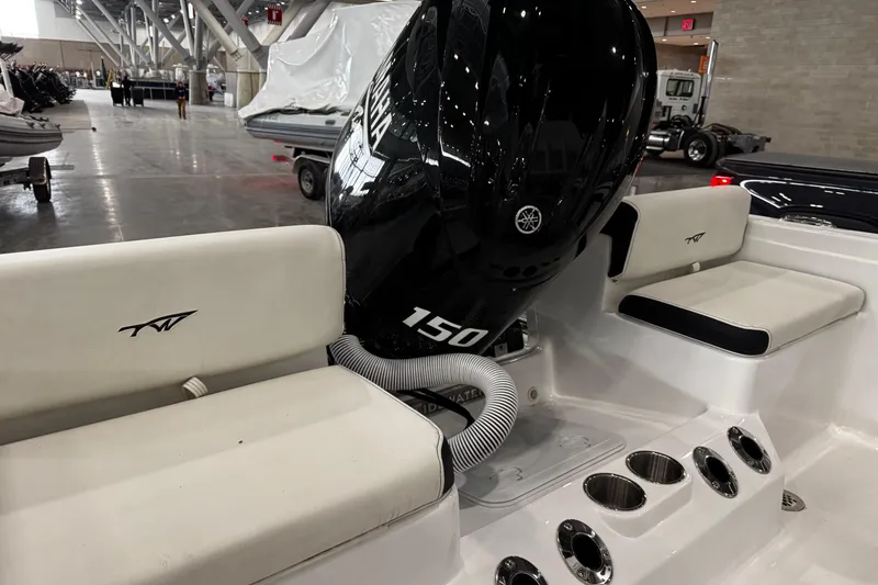 Slide: The Image of 2026 Tidewater 198 CC Adventure boat with powerful 150 HP engine in showroom. - 7