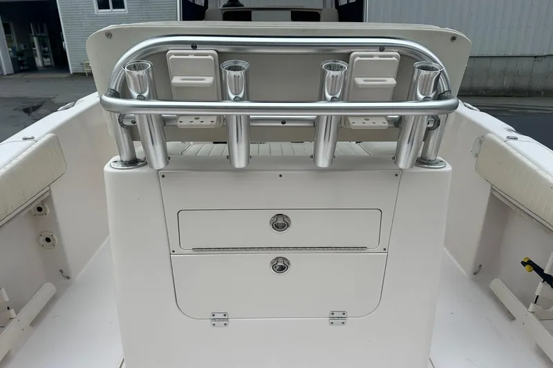Slide: The Image of Grady-White Advance 247 boat interior, featuring rod holders and storage compartments, 2000 model. - 10