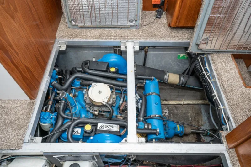 Slide: The Image of Engine compartment of a 1993 Carver 350 Aft Cabin Motor Yacht, showcasing blue machinery. - 19