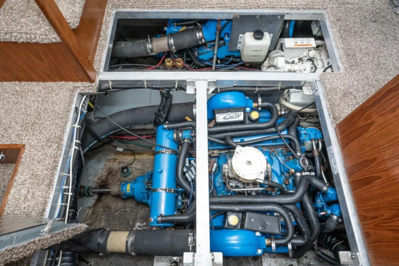 Slide: The Image of Engine compartment of 1993 Carver 350 Aft Cabin Motor Yacht, showcasing blue engine components. - 20
