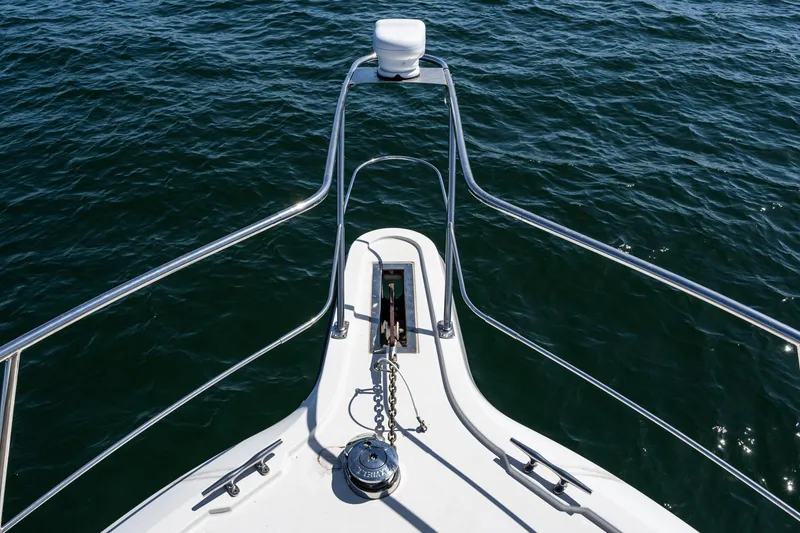Slide: The Image of Bow view of 1993 Carver 350 Aft Cabin Motor Yacht on open water. - 21