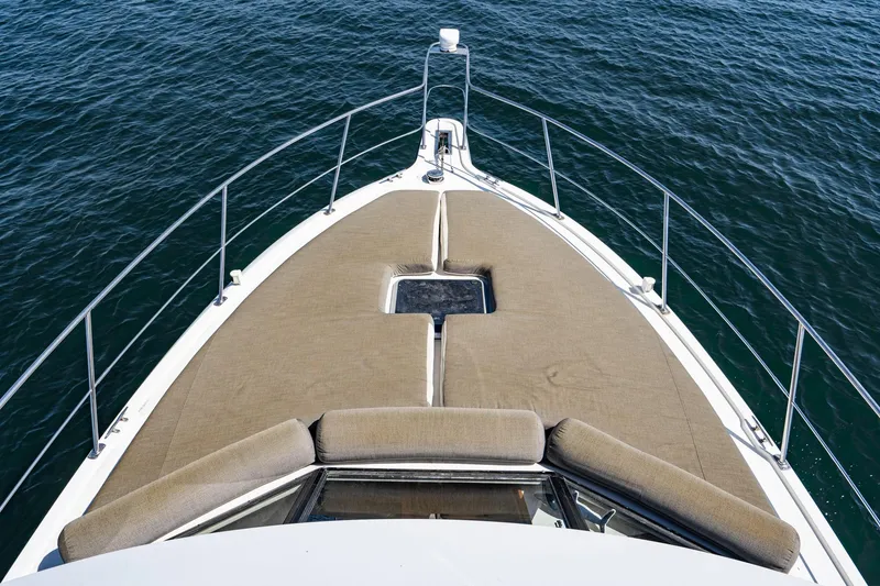 Slide: The Image of 1993 Carver 350 Aft Cabin Motor Yacht bow view on open water. - 4