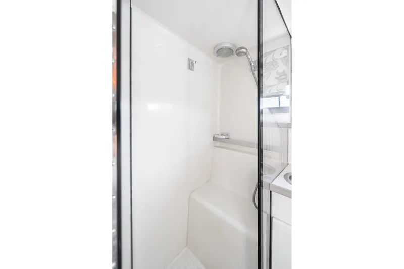 Slide: The Image of Shower area in 1993 Carver 350 Aft Cabin Motor Yacht, featuring sleek white design. - 7