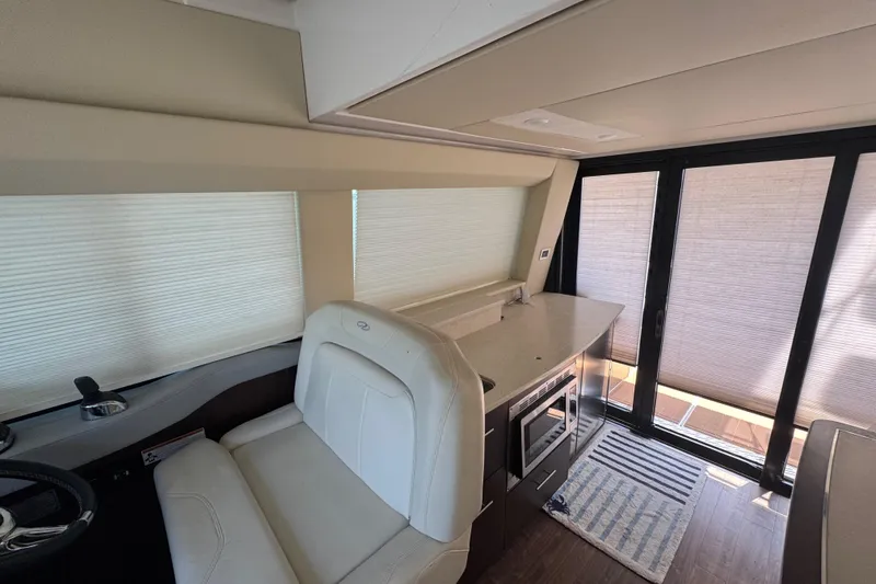 Slide: The Image of Interior of 2019 Regal 42 Fly yacht with modern kitchen and seating area. - 23
