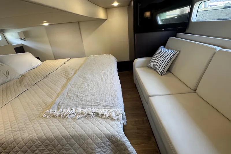 Slide: The Image of Luxurious interior of 2019 Regal 42 Fly yacht with cozy bed and sofa. - 27