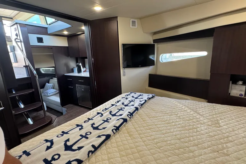 Slide: The Image of Luxurious interior of 2019 Regal 42 Fly yacht with cozy bedroom and modern amenities. - 34