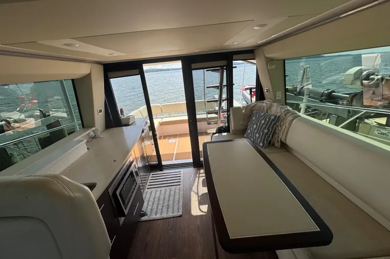 Slide: The Image of Luxurious interior of 2019 Regal 42 Fly yacht with modern kitchen and seating area. - 54