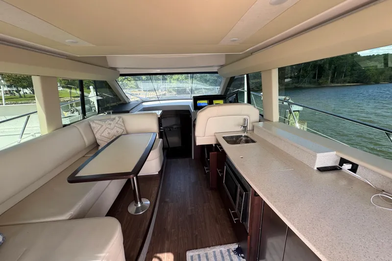 Slide: The Image of Luxurious interior of 2019 Regal 42 Fly yacht with modern amenities and scenic water view. - 55