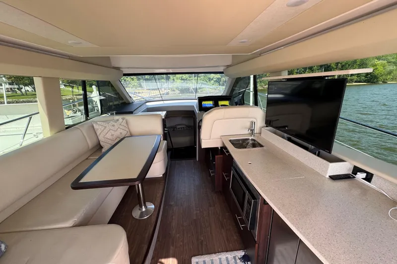 Slide: The Image of Luxurious interior of 2019 Regal 42 Fly yacht with modern amenities and scenic water view. - 57