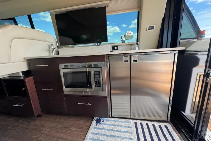 Slide: The Image of Interior of 2019 Regal 42 Fly yacht with modern kitchen appliances and sleek design. - 59