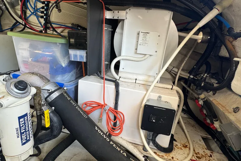 Slide: The Image of Engine room of 2019 Regal 42 Fly yacht with mechanical components and wiring. - 62