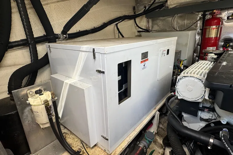 Slide: The Image of Engine room of 2019 Regal 42 Fly yacht with generator and equipment. - 63