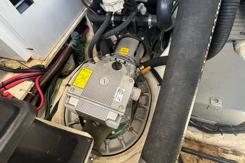 Slide: The Image of Engine compartment of a 2019 Regal 42 Fly boat, showcasing mechanical components and wiring. - 65