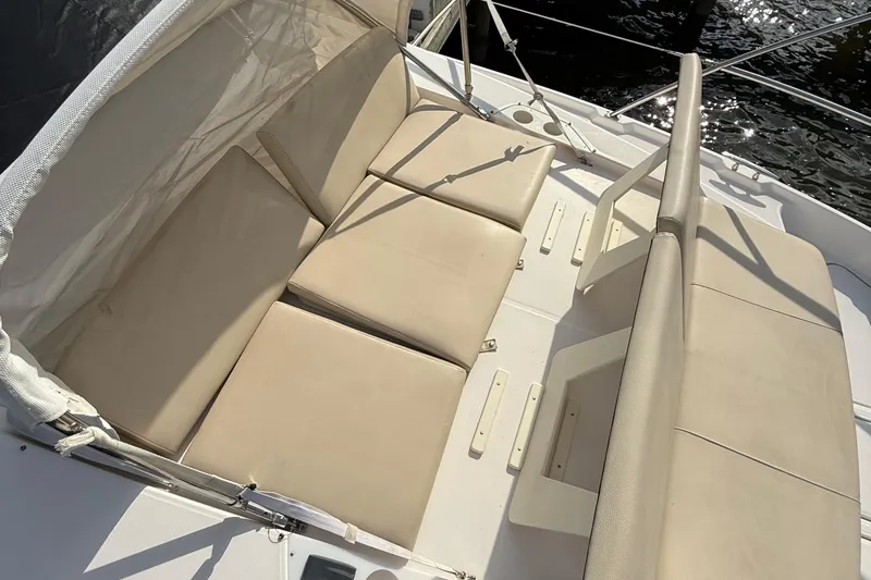 Slide: The Image of Luxurious seating on 2019 Regal 42 Fly yacht, featuring beige cushions and sleek design. - 9