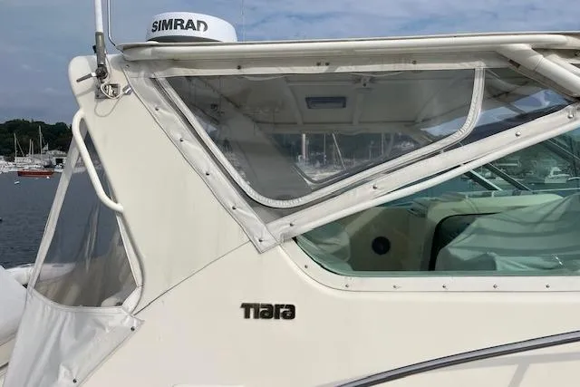 Slide: The Image of 1998 Tiara Yachts 3500 Open boat with Simrad equipment, docked in a marina. - 16