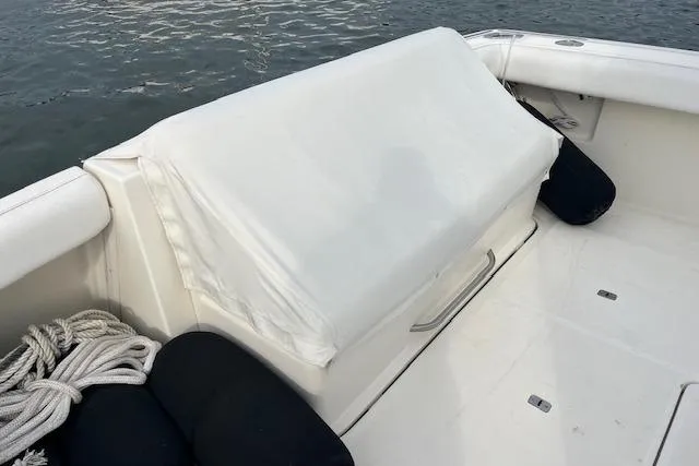 Slide: The Image of 1998 Tiara Yachts 3500 Open boat deck with covered seating and nautical ropes. - 18