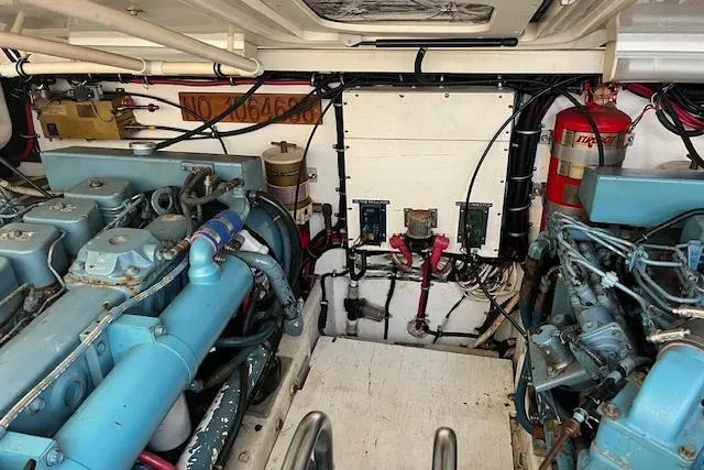 Slide: The Image of Engine room of a 1998 Tiara Yachts 3500 Open, showcasing dual engines and equipment. - 46