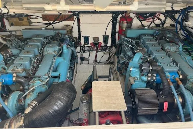 Slide: The Image of Engine room of a 1998 Tiara Yachts 3500 Open, featuring dual marine engines. - 47