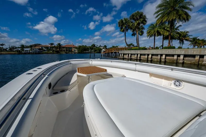 Slide: The Image of Boston Whaler 370 Outrage 2011 boat on water, palm trees, and blue sky background. - 8