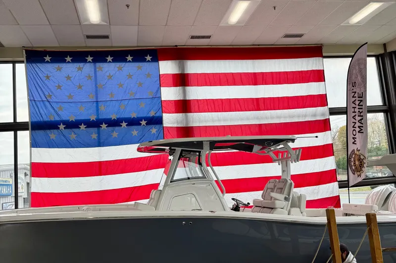 Slide: The Image of 2026 Tidewater 302 CC Adventure boat with Yamaha engines and Seakeeper Ride stabilization. - 10