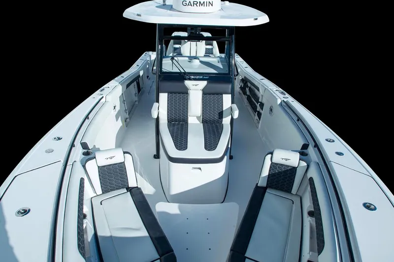 Slide: The Image of 2026 Tidewater 302 CC Adventure boat on trailer, parked outdoors. - 2