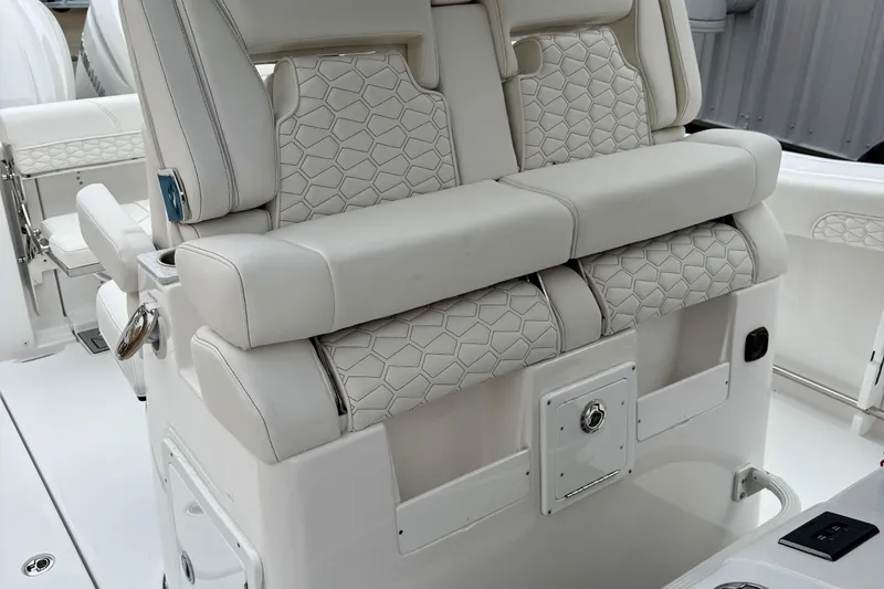 Slide: The Image of Control panel and storage compartment on 2026 Tidewater 302 CC Adventure boat. - 21