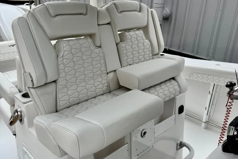 Slide: The Image of Luxurious seating on 2026 Tidewater 302 CC Adventure boat with elegant stitching design. - 22