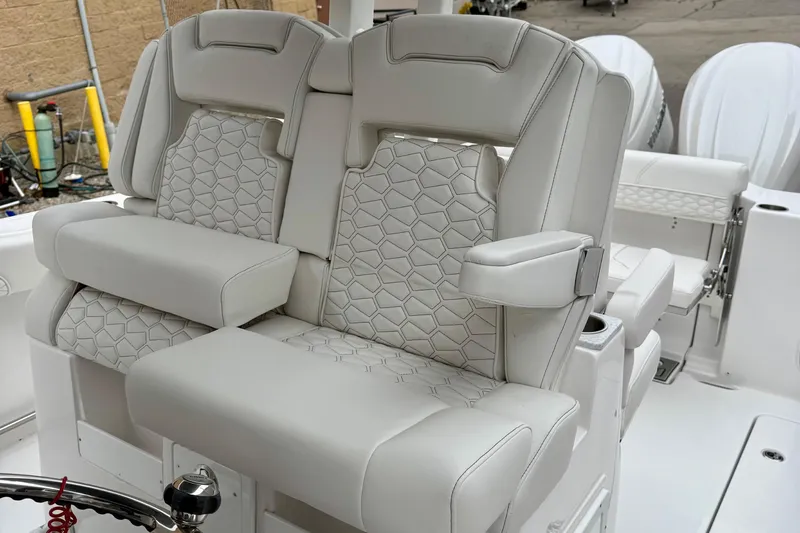 Slide: The Image of Garmin marine radio on 2026 Tidewater 302 CC Adventure boat dashboard. - 27