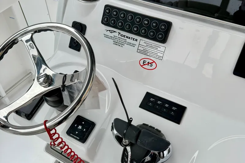 Slide: The Image of Control panel of 2026 Tidewater 302 CC Adventure boat with Yamaha controls. - 29