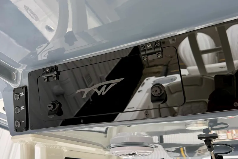 Slide: The Image of Interior view of 2026 Tidewater 302 CC Adventure boat with compass and windshield. - 31