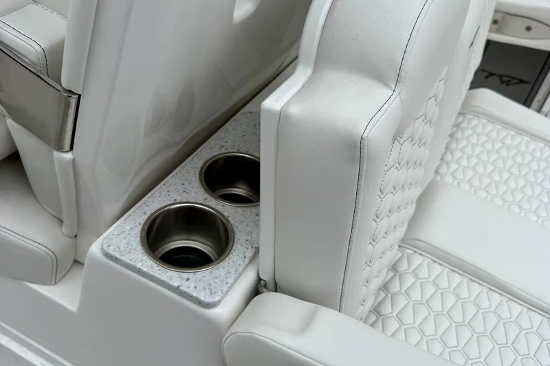 Slide: The Image of 2026 Tidewater 302 CC Adventure boat console with sleek black panel and control buttons. - 32