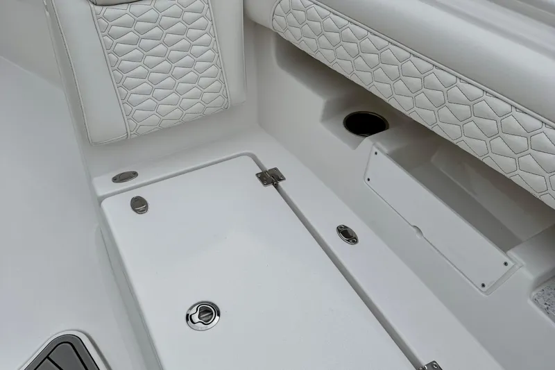 Slide: The Image of Interior of 2026 Tidewater 302 CC Adventure boat with white seating and speakers. - 41