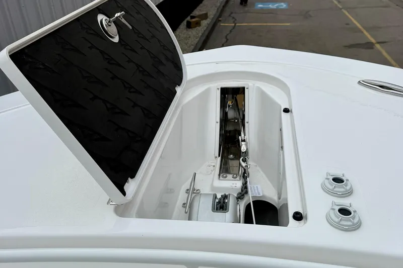 Slide: The Image of 2026 Tidewater 302 CC Adventure boat interior with cushioned seating and non-slip flooring. - 44