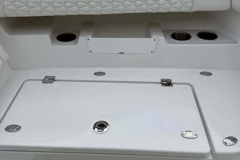 Slide: The Image of Open anchor compartment on 2026 Tidewater 302 CC Adventure boat, showcasing chain and mechanism. - 45