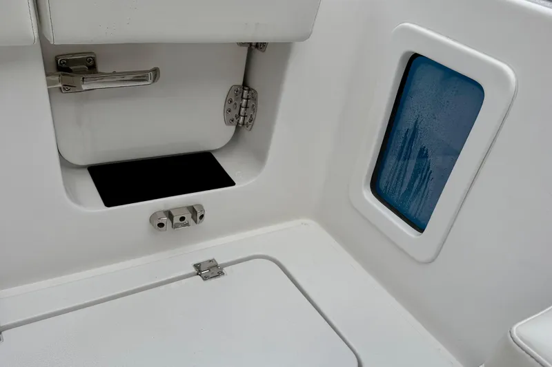 Slide: The Image of Interior of 2026 Tidewater 302 CC Adventure boat, featuring sleek stainless steel fittings. - 52