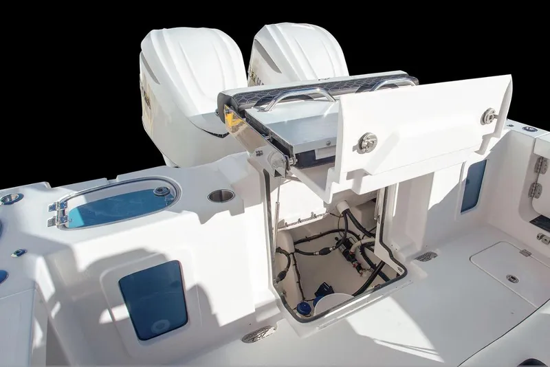 Slide: The Image of 2026 Tidewater 302 CC Adventure boat on trailer near marine building. - 6