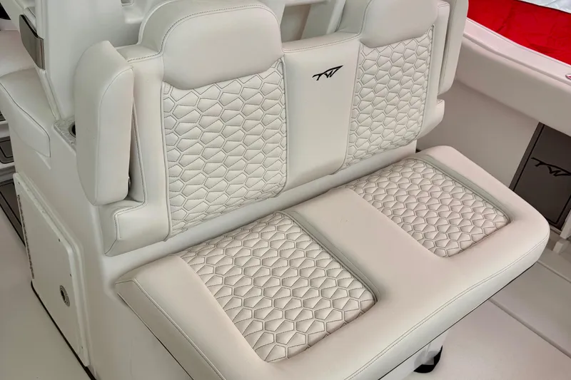 Slide: The Image of Interior view of 2026 Tidewater 302 CC Adventure boat, featuring storage compartment and seating. - 61