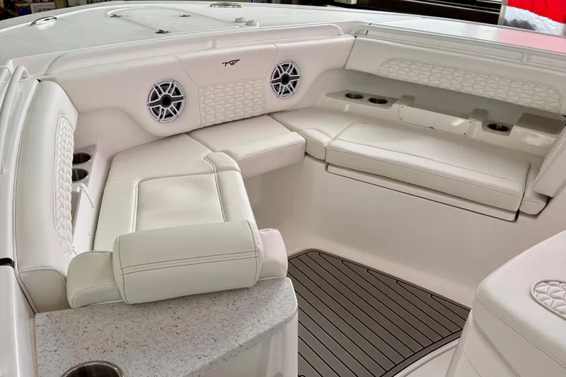 Slide: The Image of Storage compartment of 2026 Tidewater 302 CC Adventure boat, featuring a secure latch. - 64