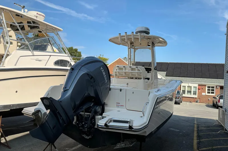 Slide: The Image of 2023 Grady-White Fisherman 236 boat with Yamaha engine, parked outdoors. - 2