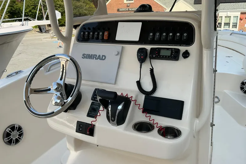 Slide: The Image of 2023 Grady-White Fisherman 236 boat console with steering wheel and controls. - 3