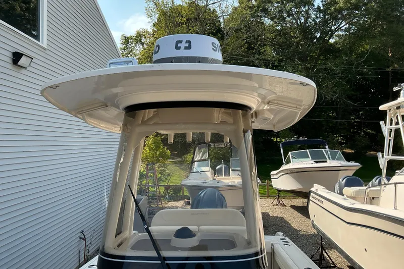 Slide: The Image of 2023 Grady-White Fisherman 236 boat with radar, docked outdoors. - 6