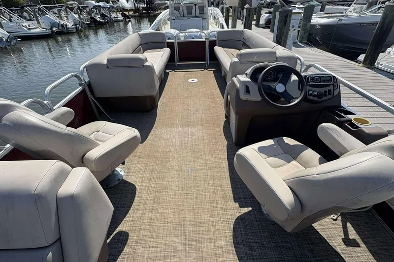 Slide: The Image of 2018 Princecraft Vectra 25 pontoon boat interior with seating and steering console. - 3