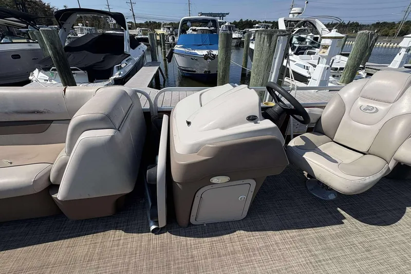 Slide: The Image of 2018 Princecraft Vectra 25 pontoon boat interior at marina dock. - 4