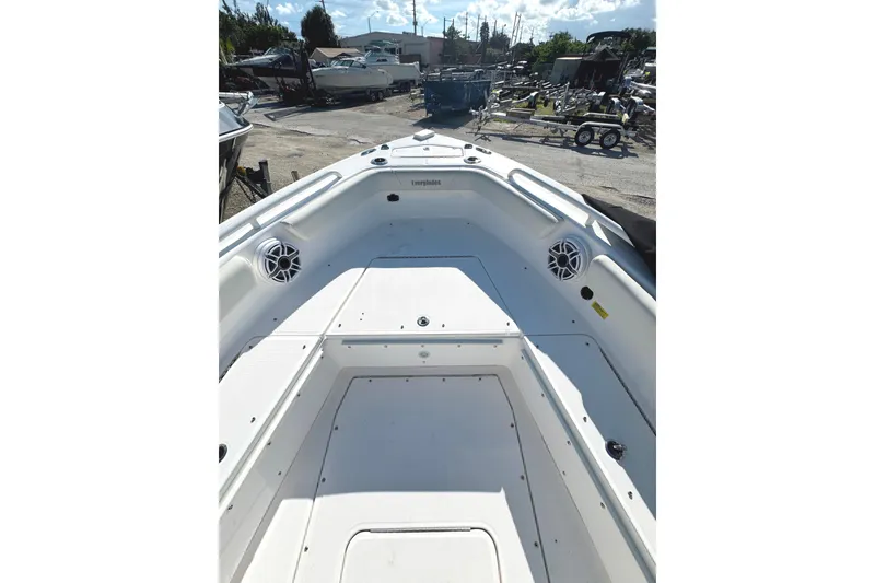 Slide: The Image of 2022 Everglades 243 Center Console boat deck with speakers, docked outdoors. - 15